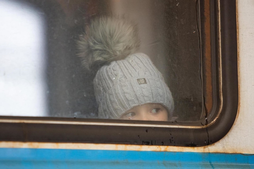 Ukrainian refugees on Lviv railway station waiting for train to