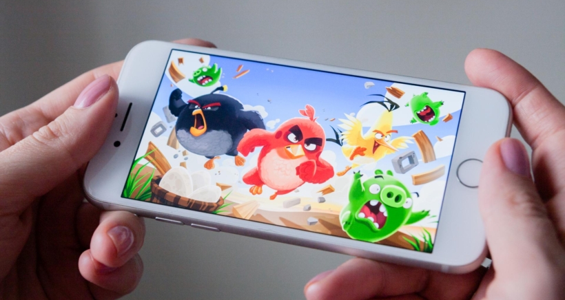 Los Angeles, California, USA – 8 March 2019: Hands holding a smartphone with Angry Birds game on display screen, Illustrative Editorial