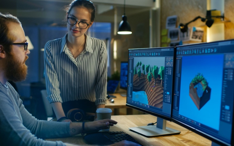 Male Game Developer Talks with Artistic Female Level Designer. T