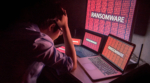 Young,Asian,Male,Frustrated,,Confused,And,Headache,By,Ransomware,Attack