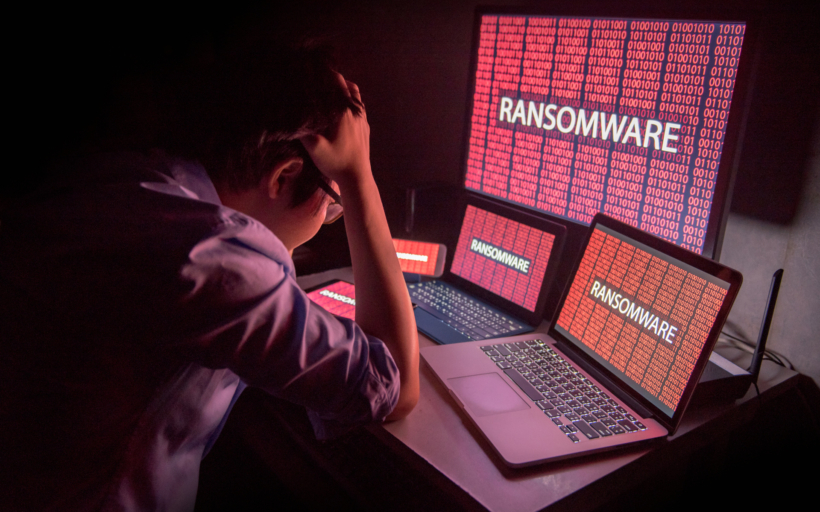 Young,Asian,Male,Frustrated,,Confused,And,Headache,By,Ransomware,Attack
